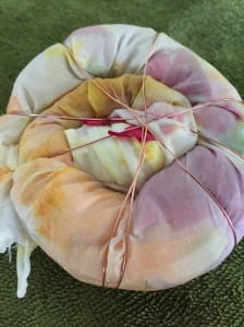 Spiraled silk stuffed with garden blooms, wrapped with copper wire